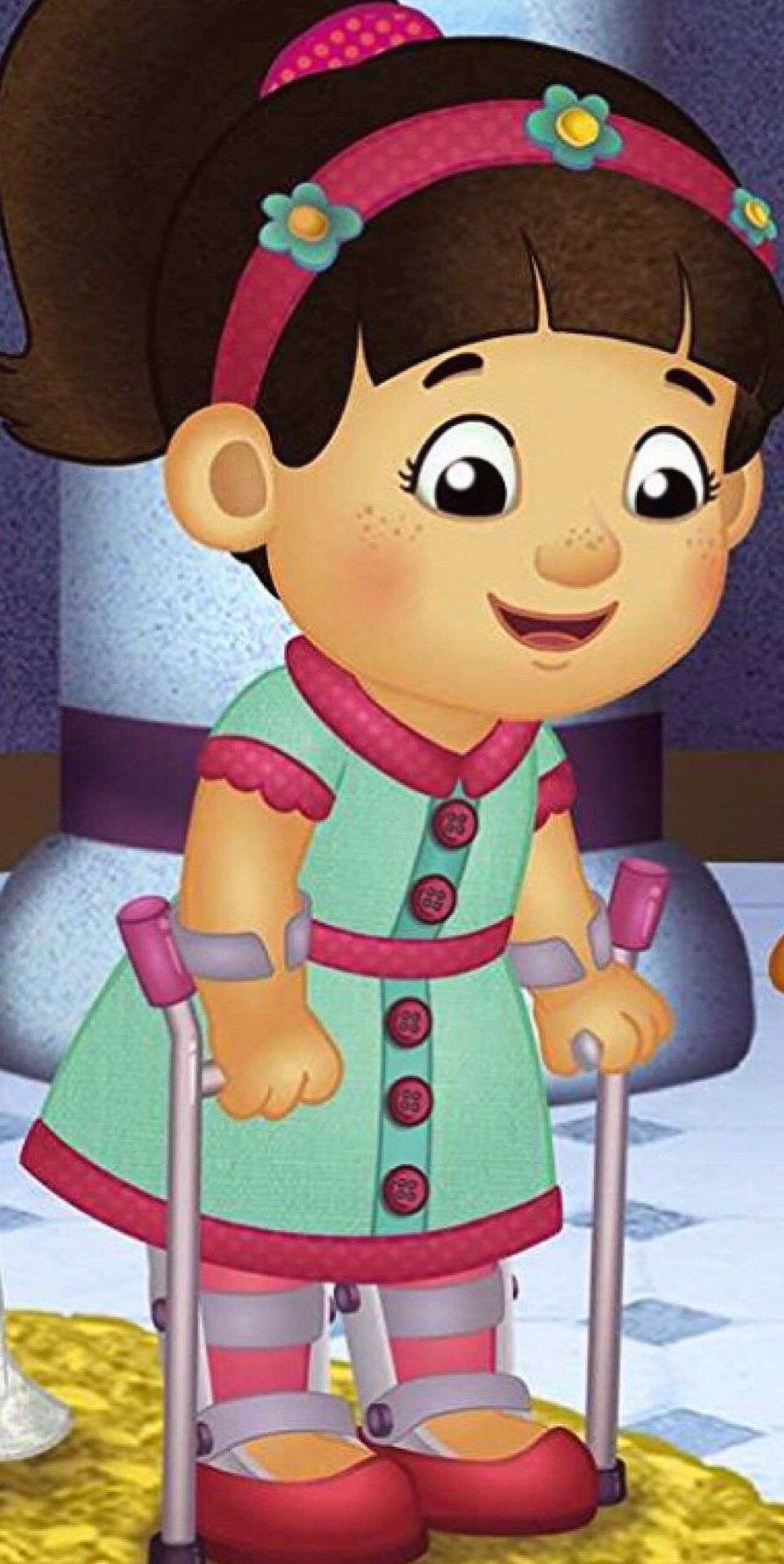 an image of Chrissie from Daniel Tiger’s Neighborhood (a cartoon girl in a teal dress with pink trim, she wears pink leggings and has two leg braces and pink forearm crutches) 